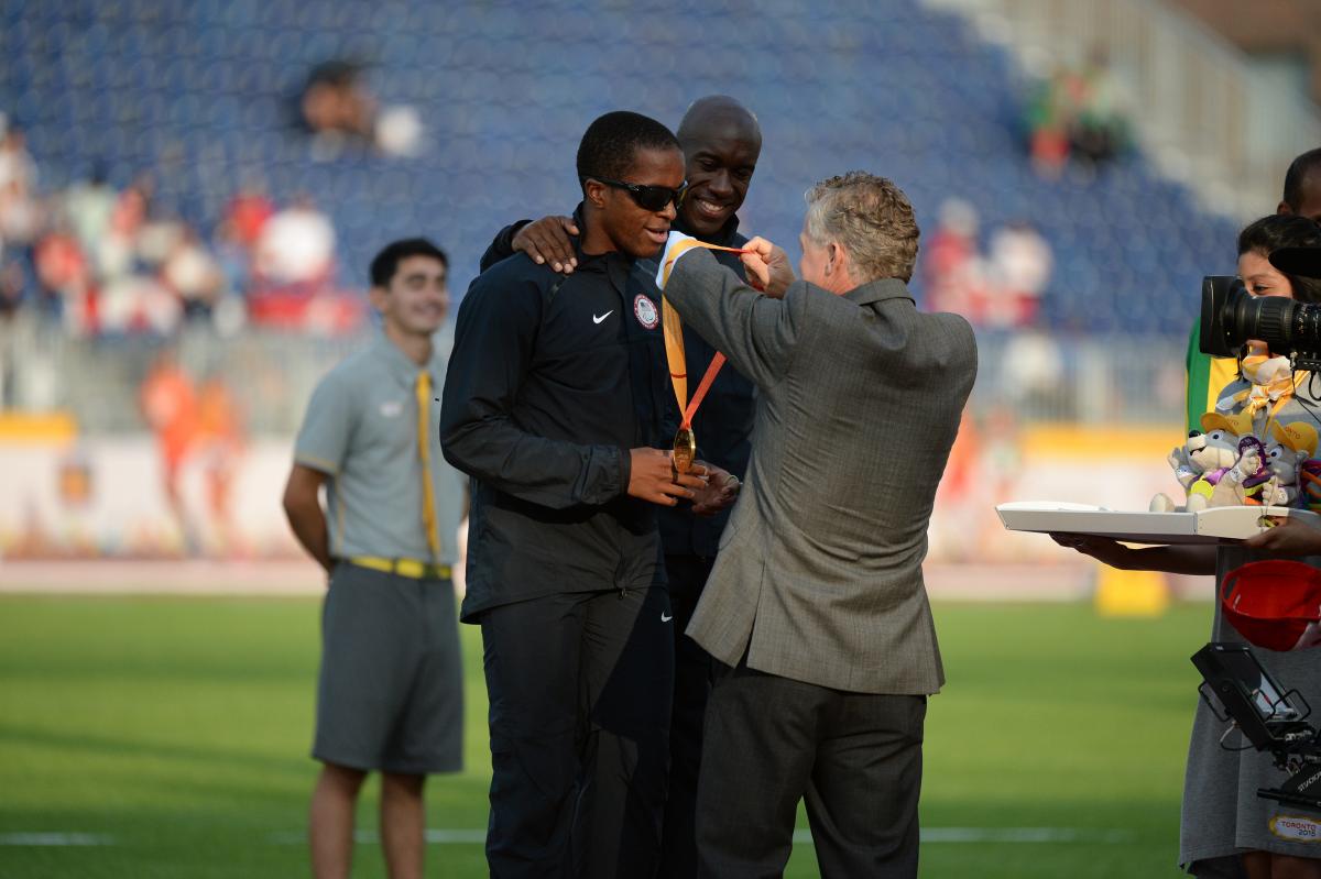 David Brown - Athletics - Toronto 2015 Parapan Americsn Games Two men on the podium receiving a medal