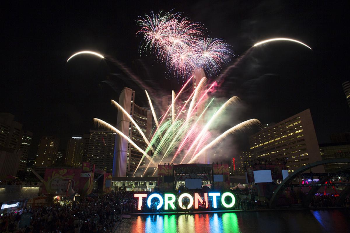 Toronto 2015 - fireworks Fireworks in different colors illuminate the night above the 3D Toronto sign