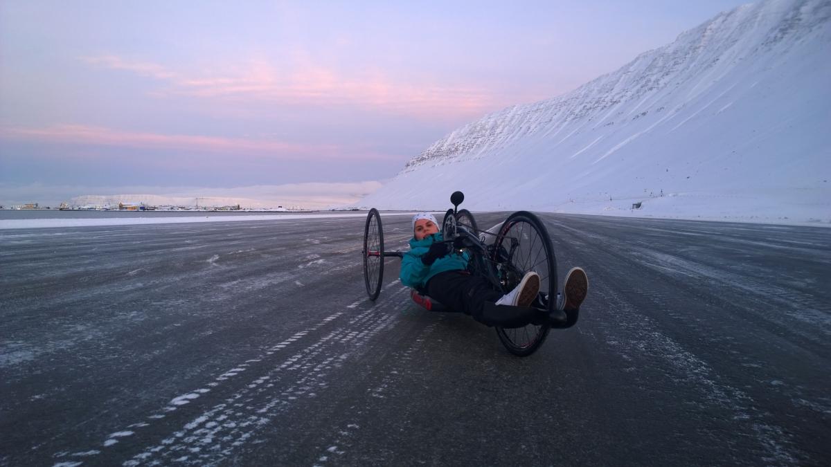 Arna Albertsdottir - cycling - Iceland Handcyclist in front of an iced mountain