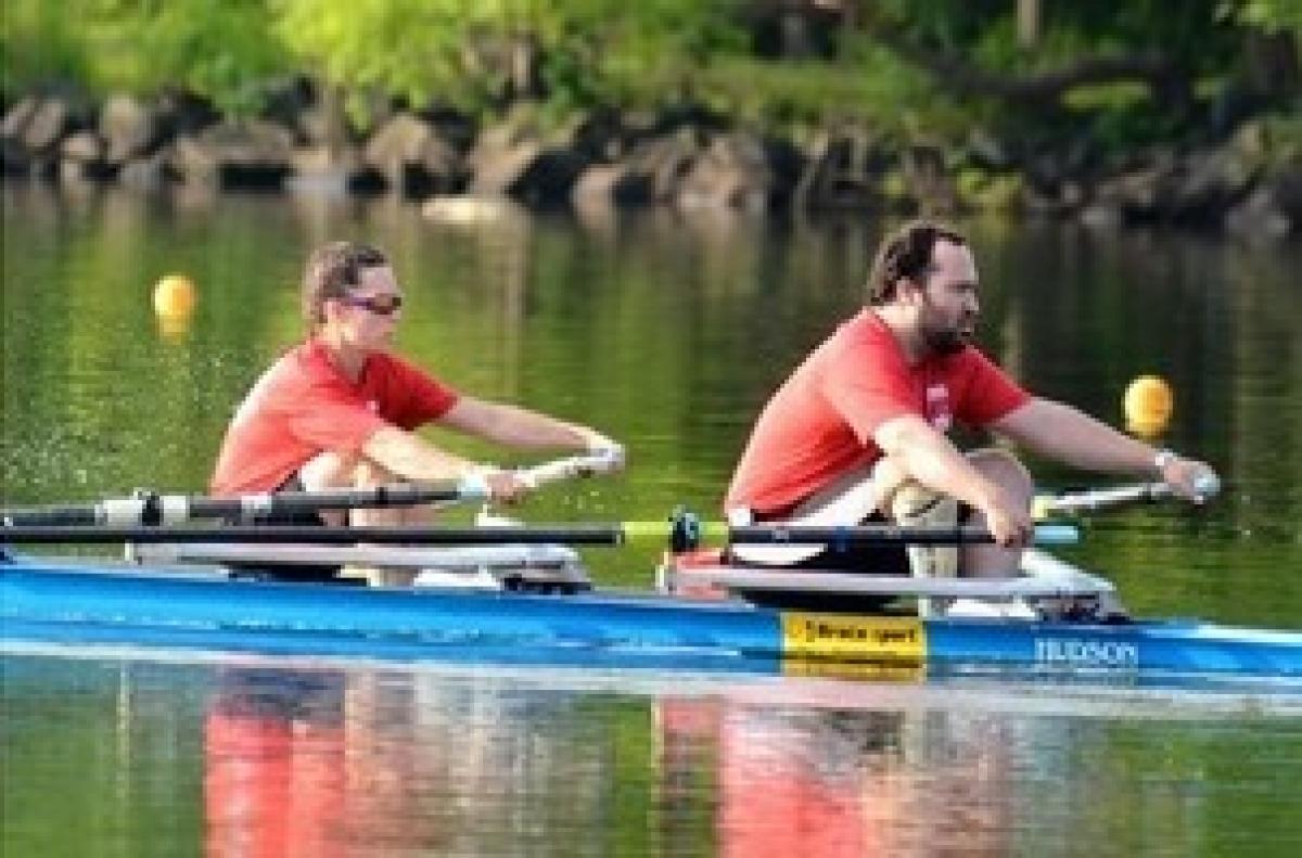 Man and woman in a boat, rowing