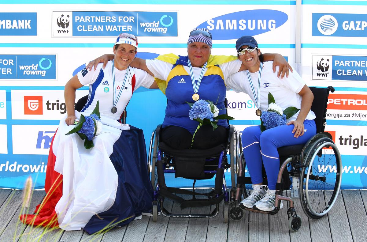 Three women smiling. 