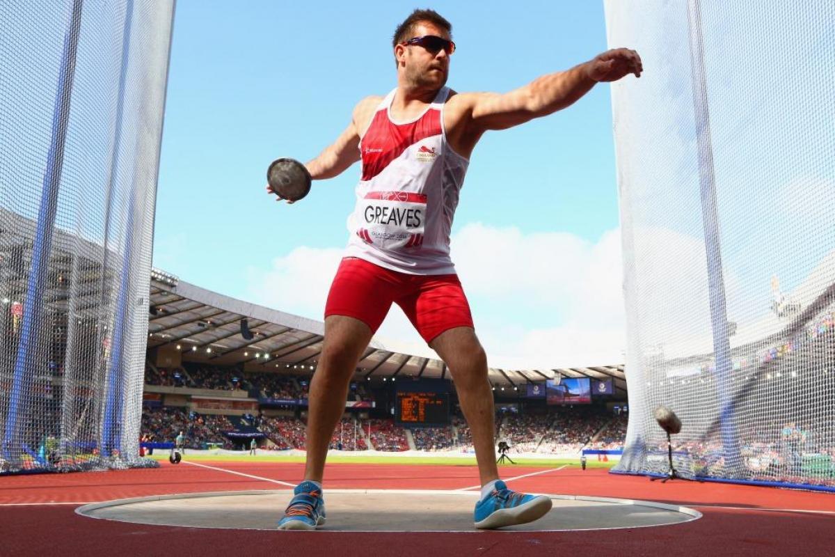 Dan Greaves of England competes in the Men's F42/44 Discus final at Hampden Park Stadium at the Glasgow 2014 Commonwealth Games.