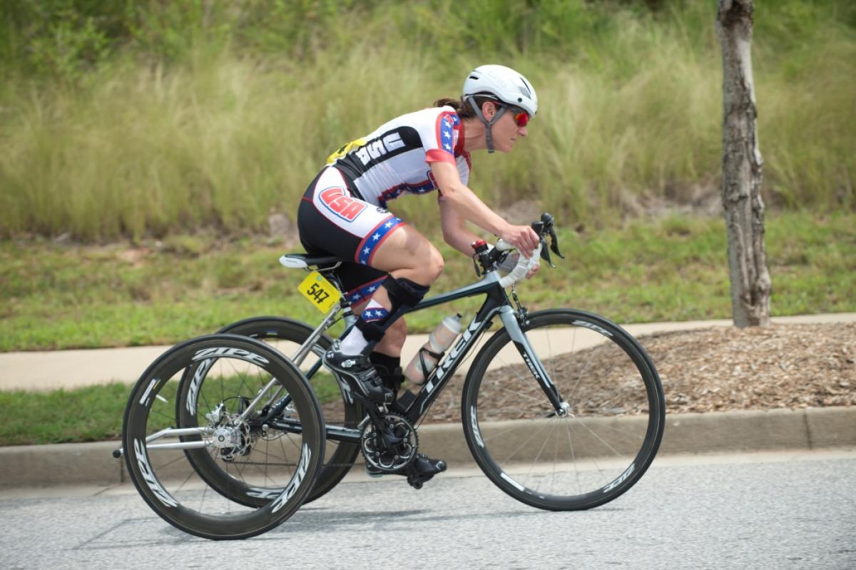 Woman on bike competing