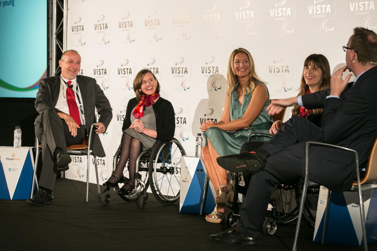 Three women and two men sitting on the podium during a podium discussion at Vista 2015.