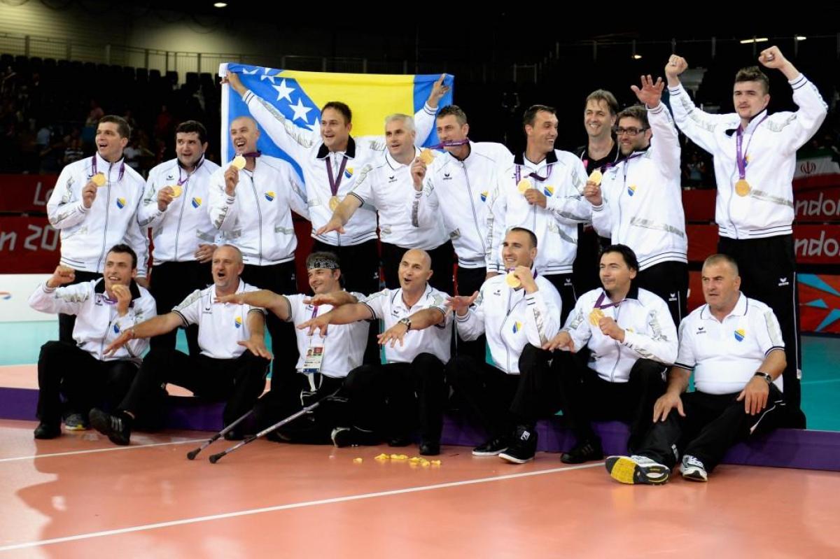 The team of Bosnia and Herzegovina celebrates after winning the gold in the Men's Sitting Volleyball competition at the London 2012 Paralympic Games.