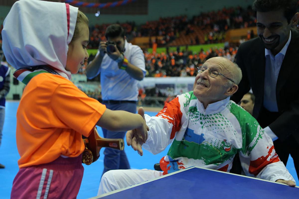 Two people shaking hands.