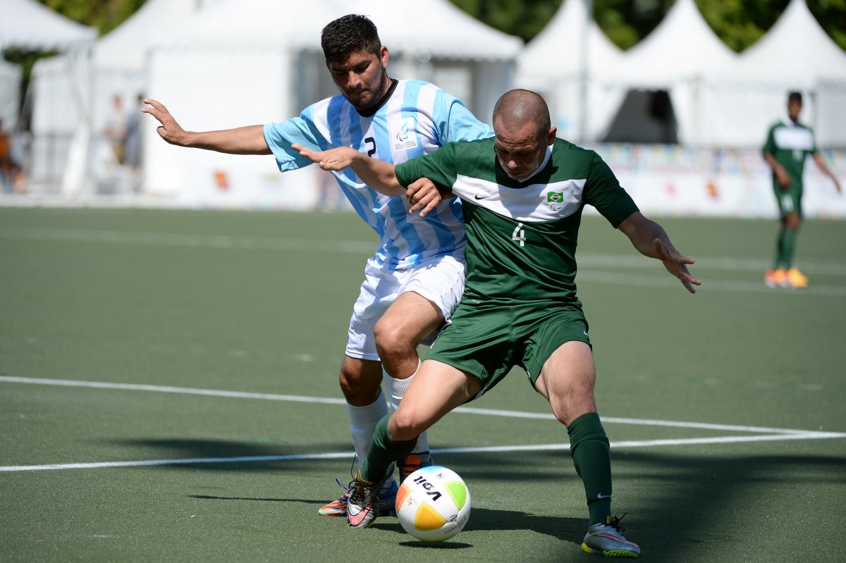 Rodrigo Luquez of Argentina and Jose Monteiro Guimaraes of Brazil in the football 7-a-side gold medal game at the Toronto 2015 Parapan American Games.