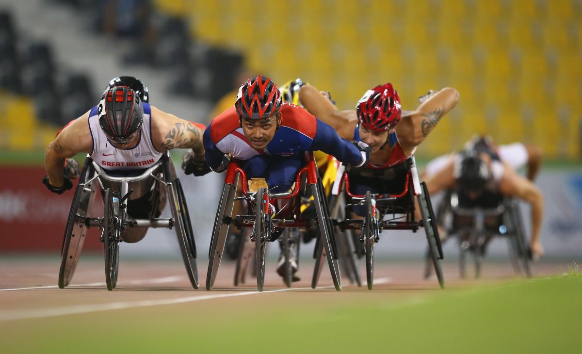 Field of wheelchair racers on track