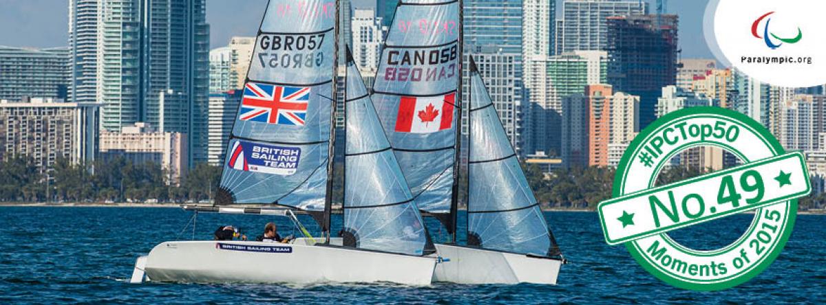 Two sailing boats in the water with skyline in the background