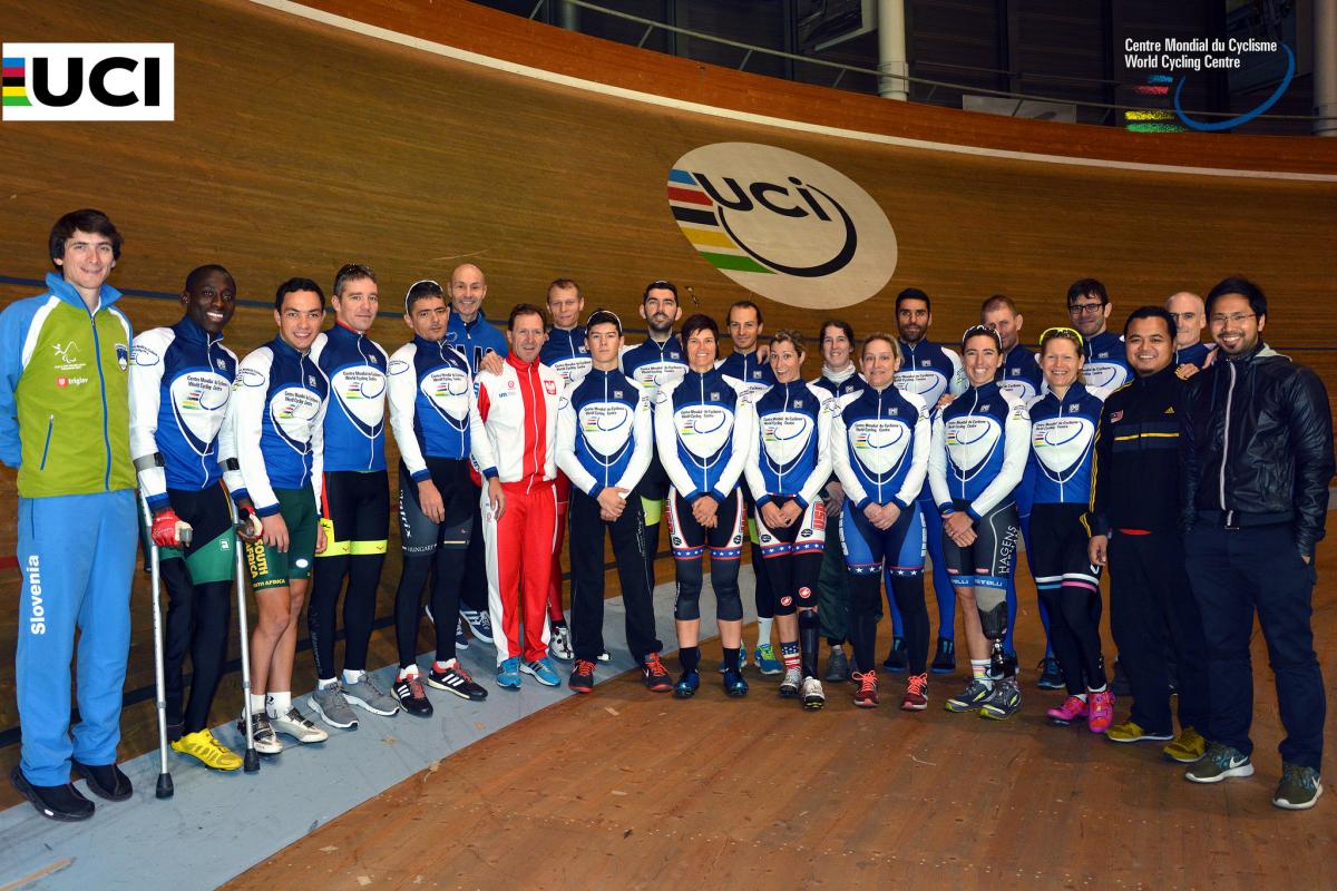 2015 Para-cycling training camp at the UCI World Cycling Centre (WCC) Group picture with around 20 people in a velodrome