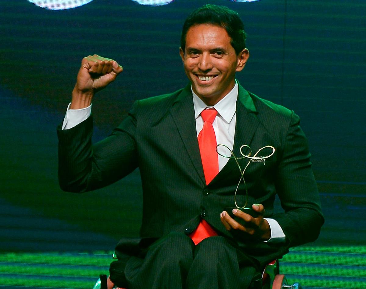 Luis Carlos Cardoso da Silva poses with his trophy won in the Paracanoe category of the Brazil Paralympics 2014 Awards Ceremony.
