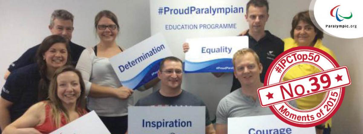 IPC Top 50 moments 2015 - No.39 #ProudParalympian launches education pilot Group shot of young people holding signs with words on it (inspiration, courage)