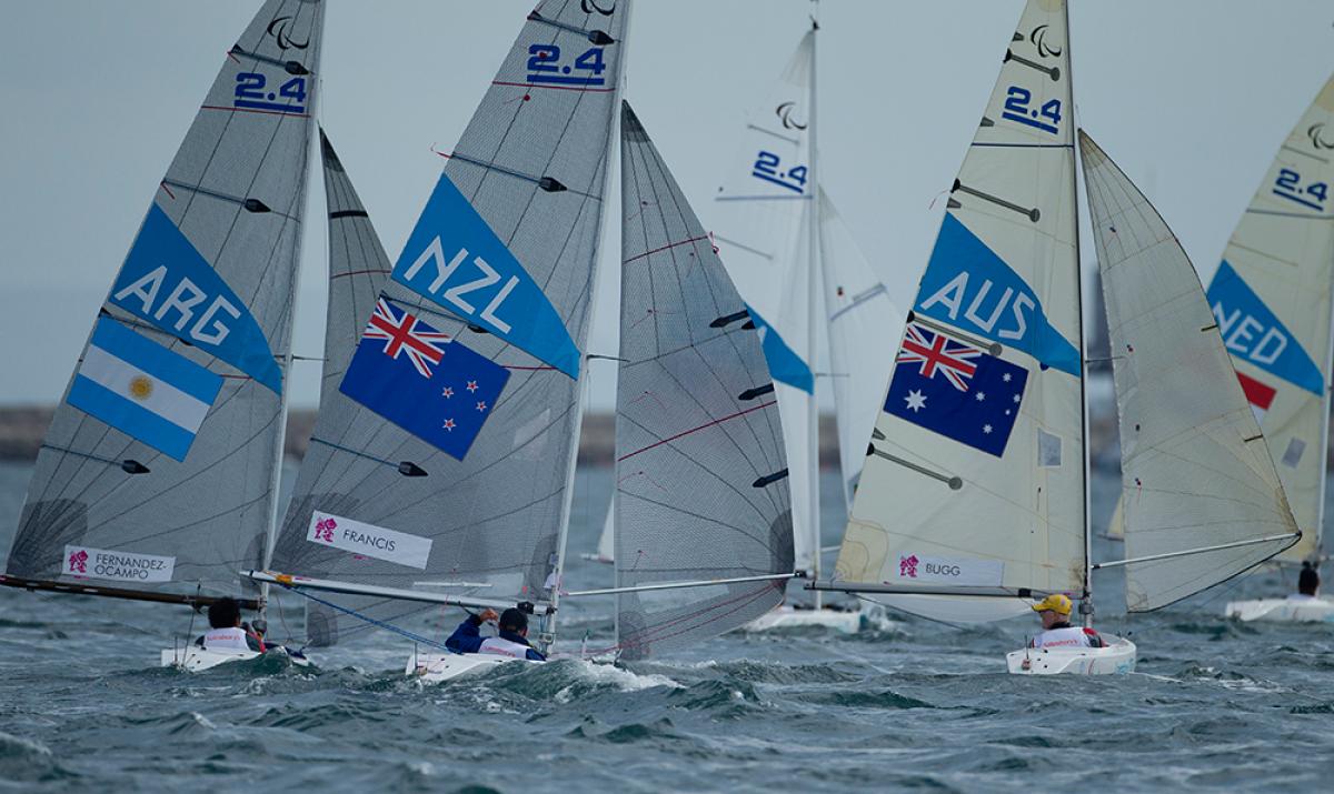 Three sailing boats on the water