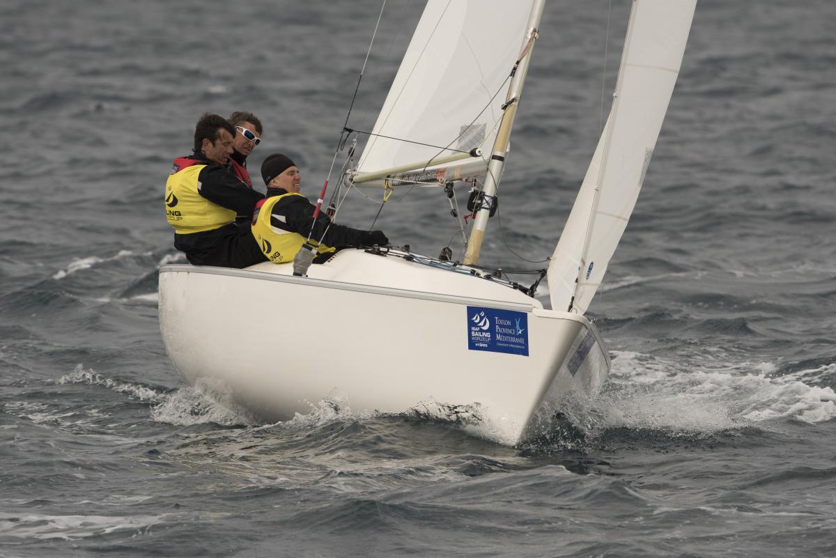 Three men sailing