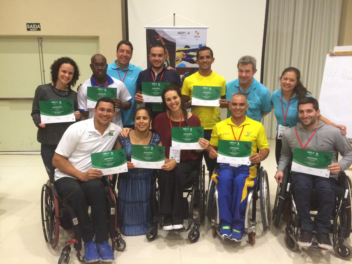 Paralympians show-off their certificates after being trained to be leaders in the Paralympic Movement