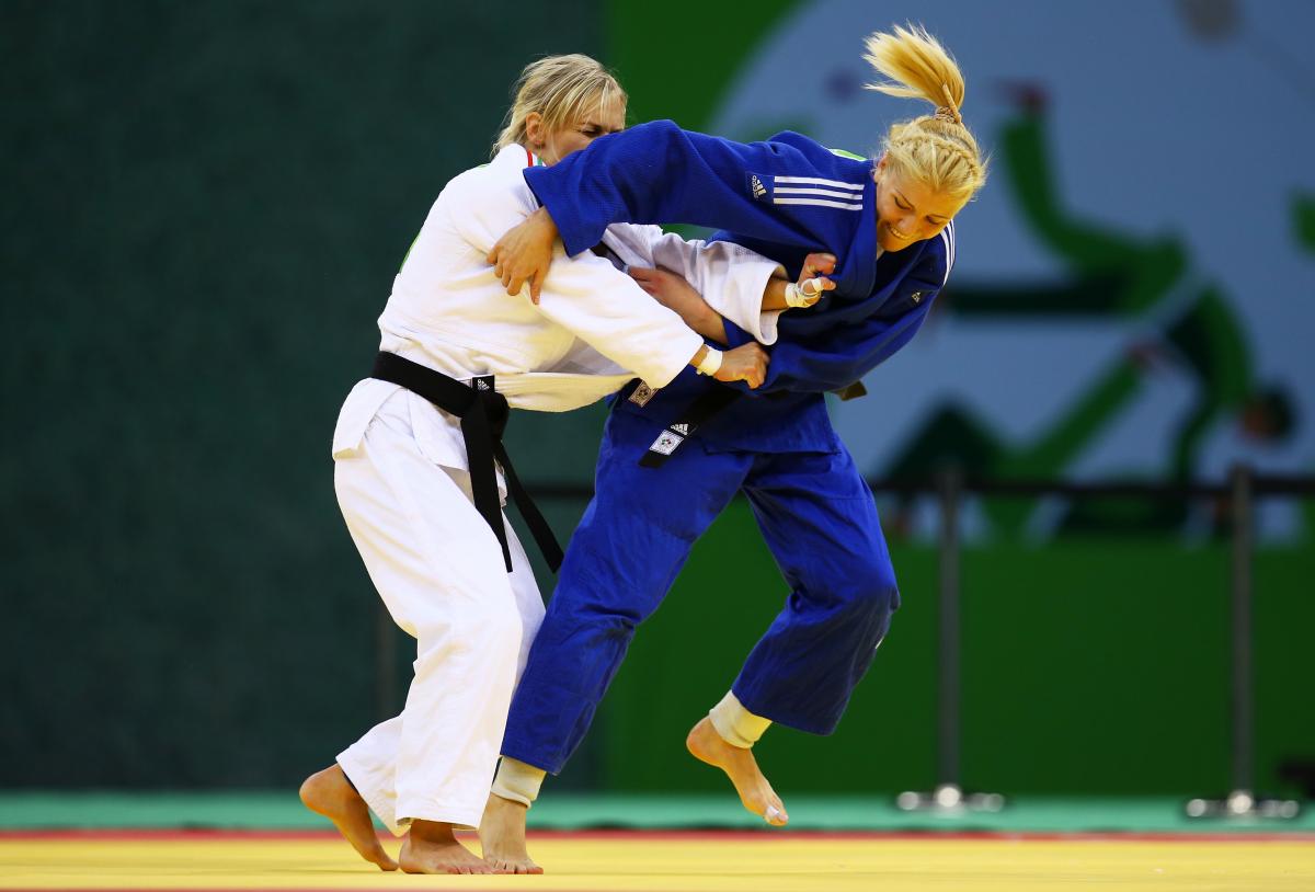 Maryna Cherniak of Ukraine (blue) and Eva Cseroviczki of Hungary (white) compete during the Women's Judo -48kg bronze medal match on day thirteen of the Baku 2015 European Games.