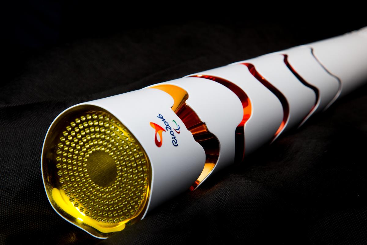 Rio 2016 Paralympic Torch design is white with red, orange circles. 