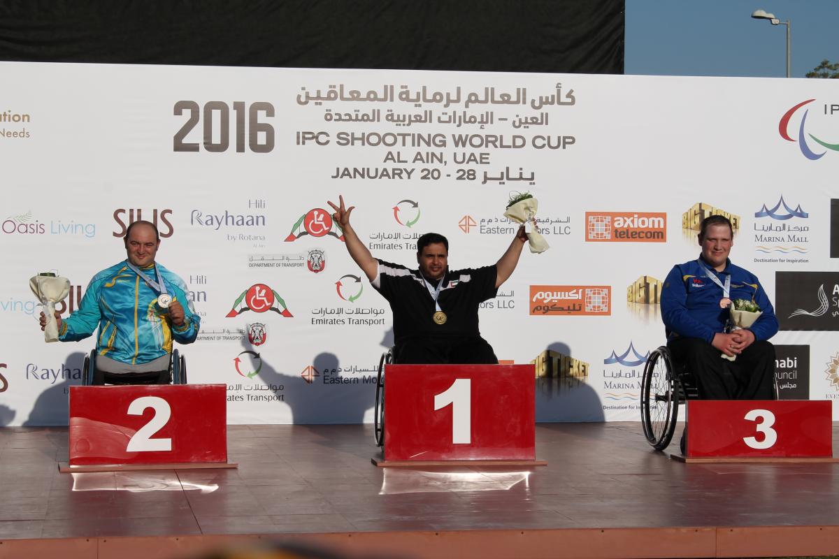 Three para-sport shooters celebrate their medals