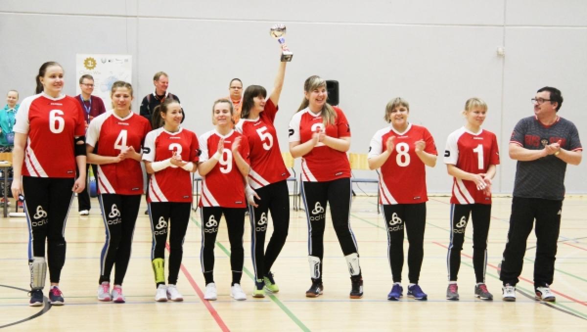 Russia women's goalball - 2016 Pajulahti Games Group of women in red jerseys, showing a trophy, smiling