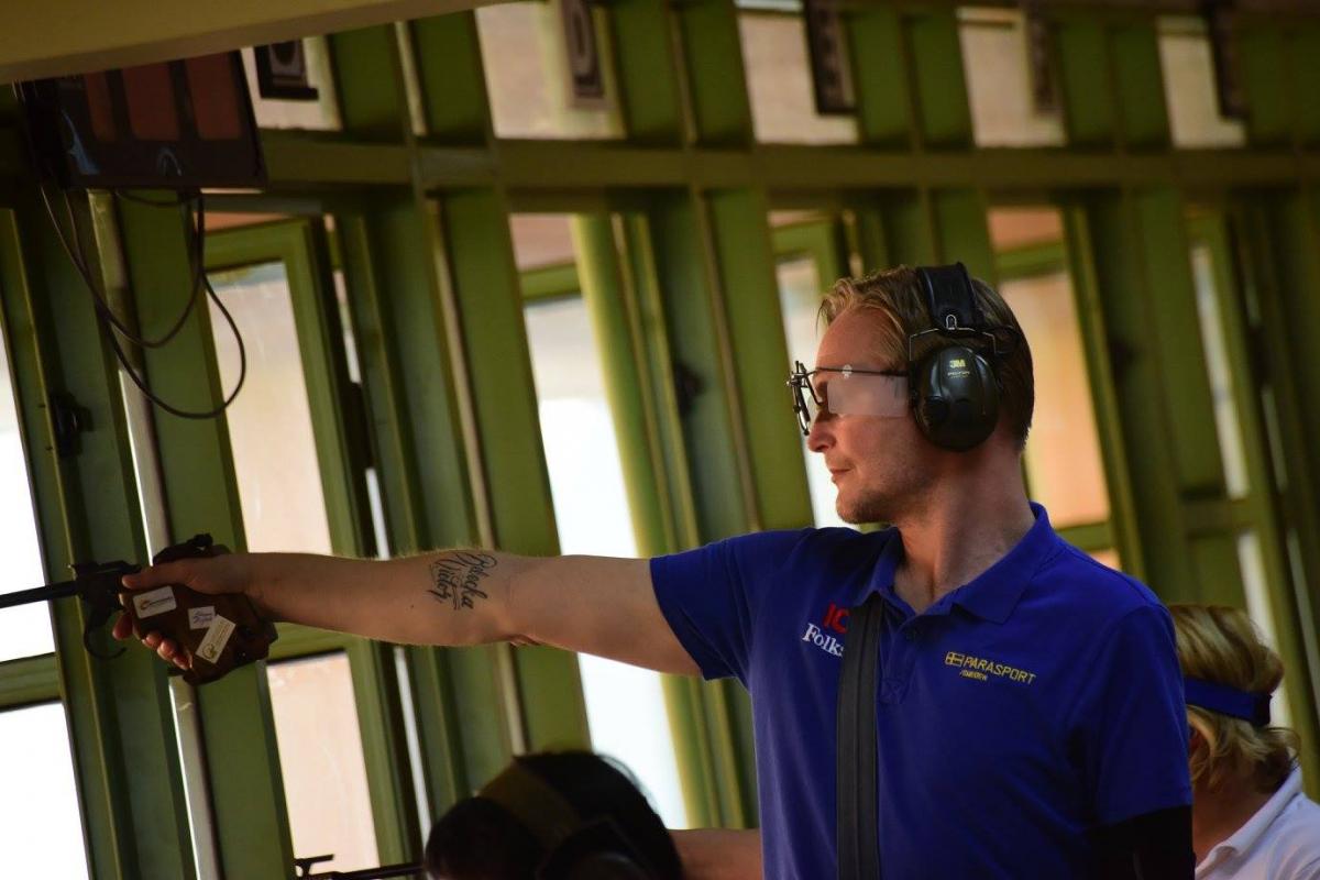Joackim Norberg A man shooting a pistol
