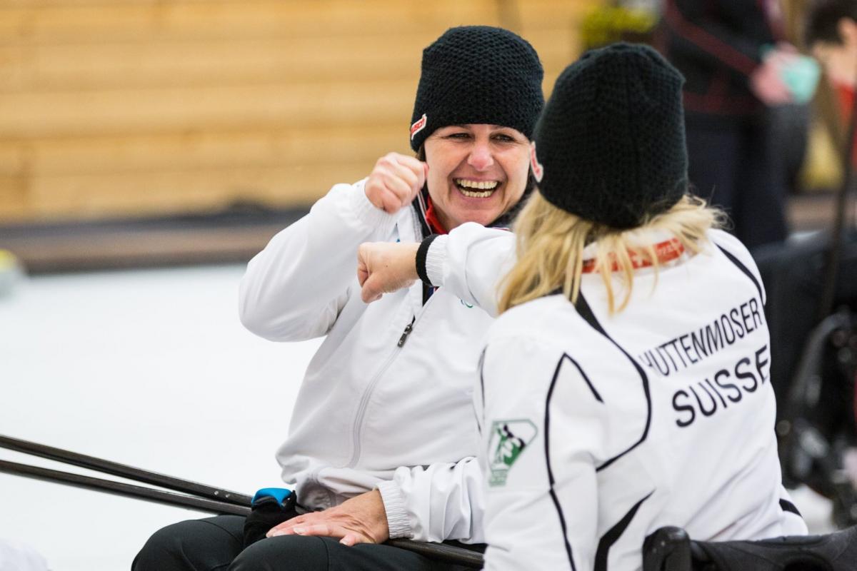 Wheelchair curlers in action