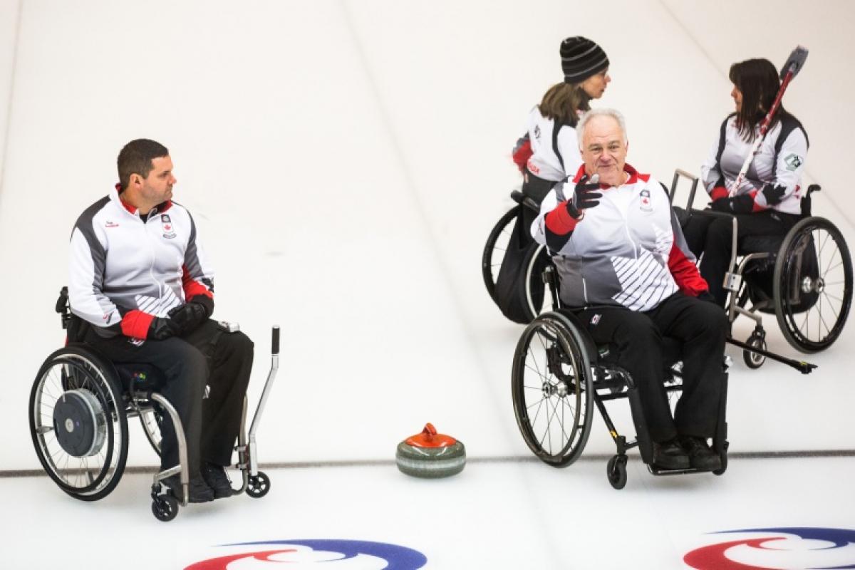 Jim Armstrong; Canada Skip and his team on the ice