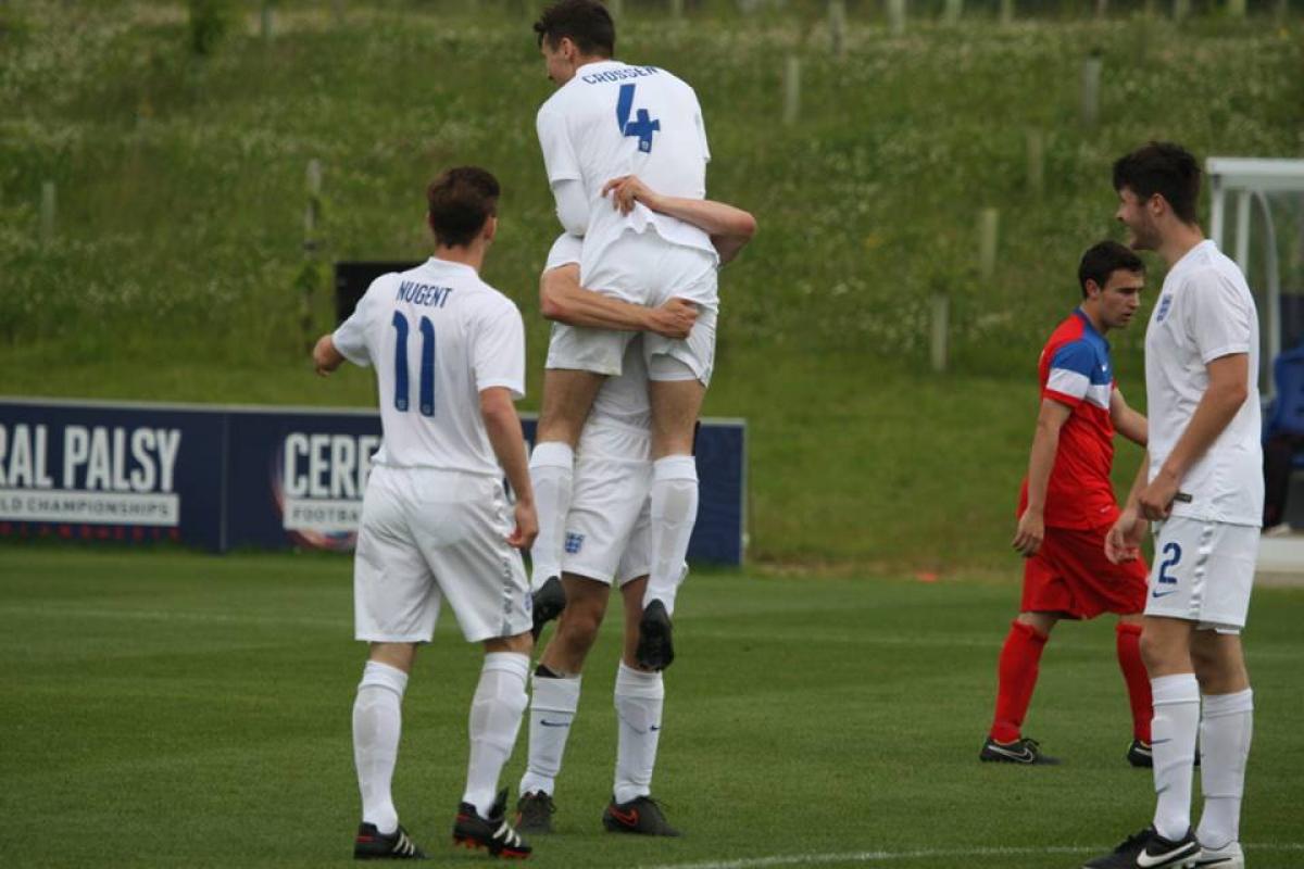 A football 7-a-side player celebrates scoring a goal