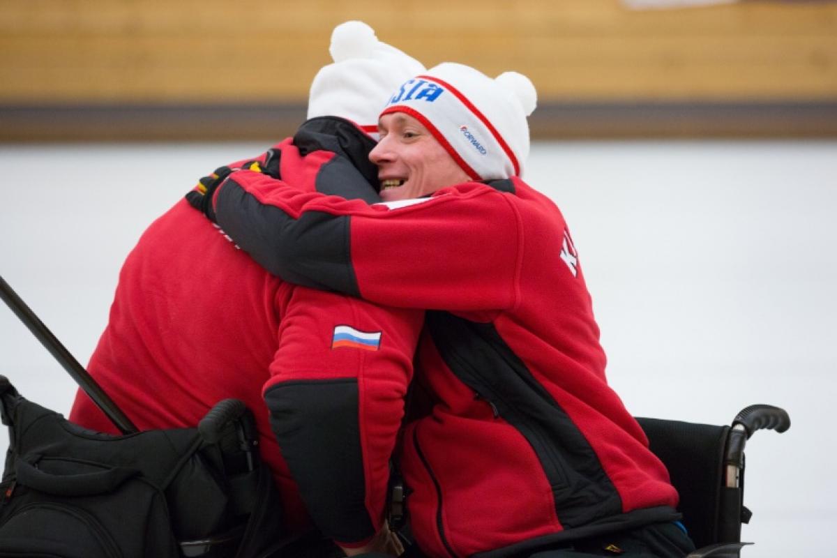 A Russian wheelchair curler celebrates progressing to the gold medal game