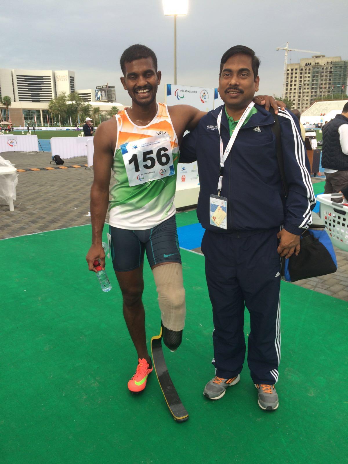 Man with a running blade posing for the camera with another man