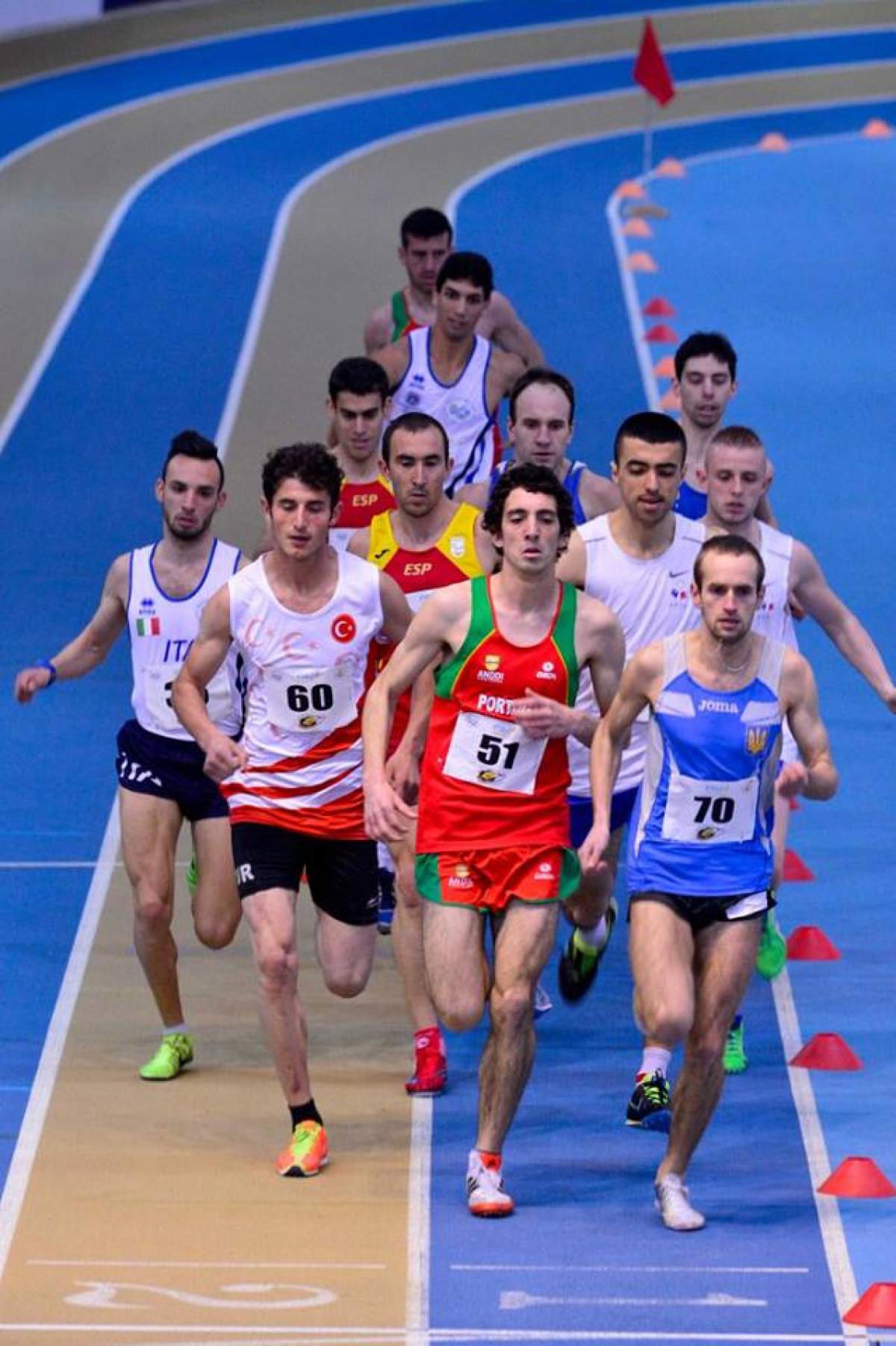 Group of men running on an indoor