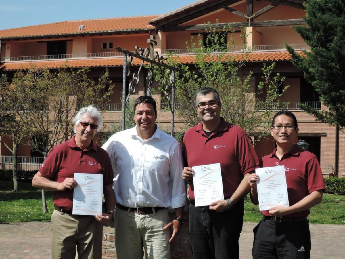Newly trained Educators David Weicker, Frederico Nantes and Yukio Seki receive their course certificates from Flavio Santos