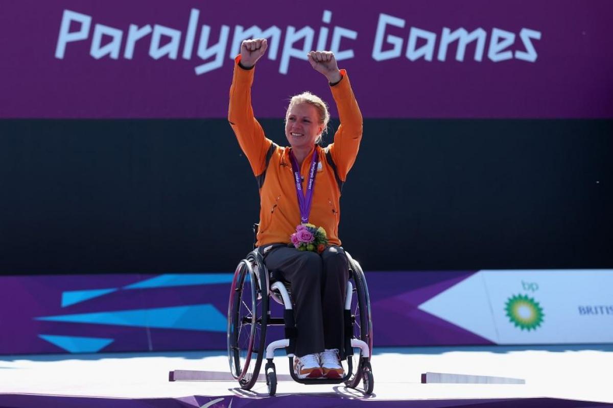 Esther Vergeer of Netherlands with her gold medal after defeating Aniek Van Koot of Netherlands in the final of the Women's singles match in the Wheelchair Tennis at the London 2012 Paralympic Games.