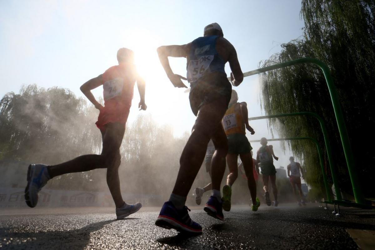 Runners enter a cooling station 