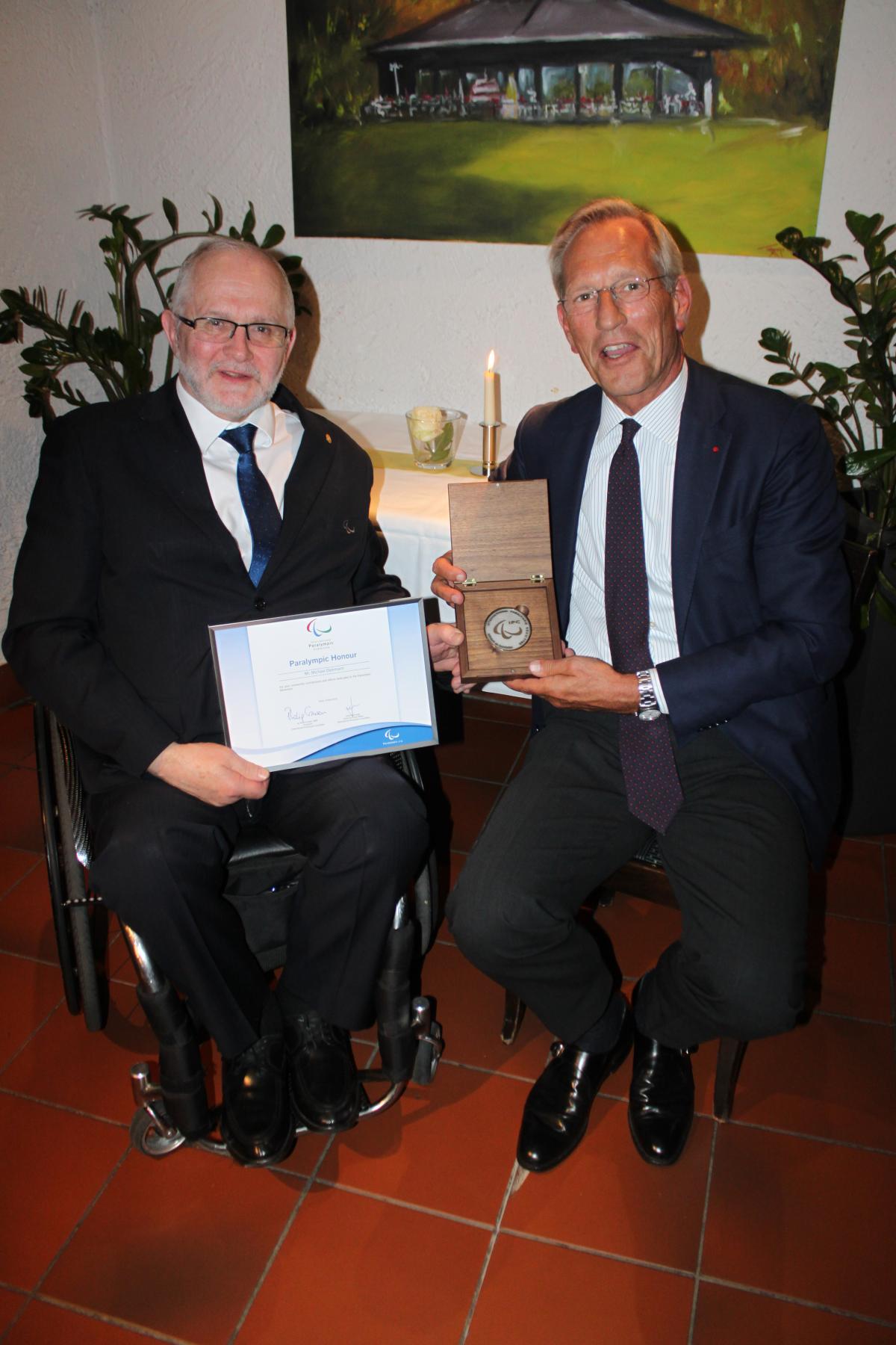 The former CEO of Allianz, Michael Diekmann, receives the Paralympic Honour from IPC President Sir Philip Craven on 15 April 2016.
