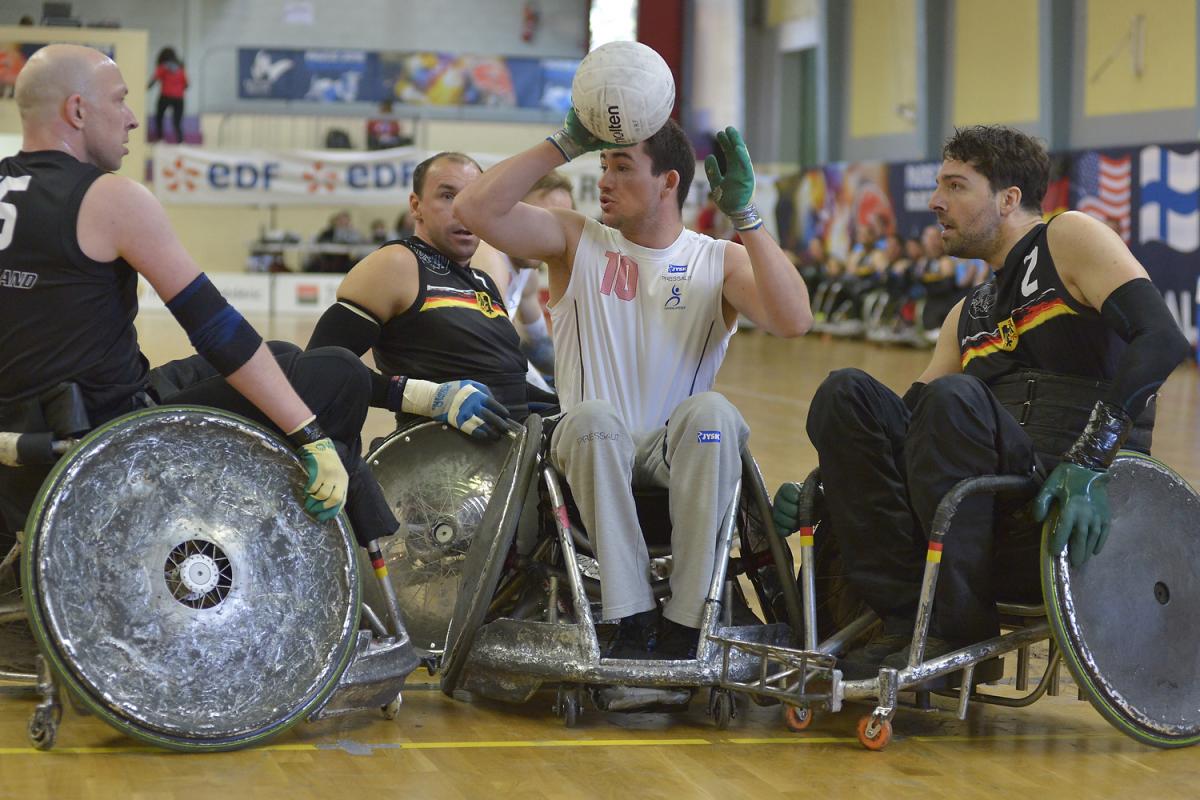 German wheelchair rugby players swarm a Danish player