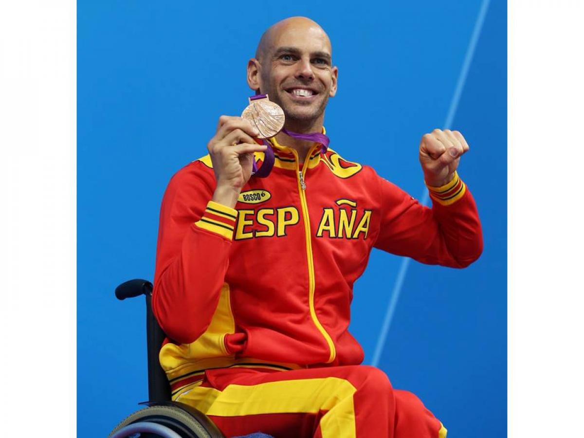 Bronze medallist Richard Oribe of Spain poses on the podium during the medal ceremony for the Men's 200m Freestyle - S4 final at the London 2012 Paralympic Games.