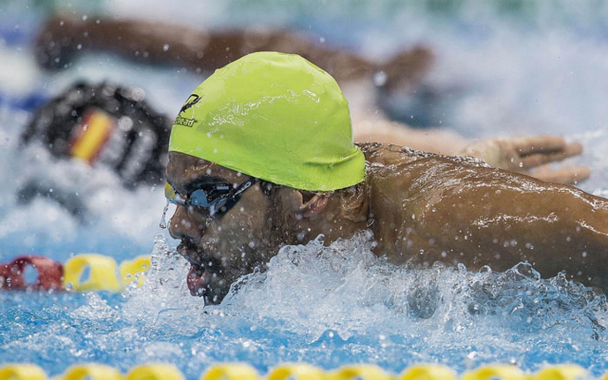 A para-swimmer competes hard