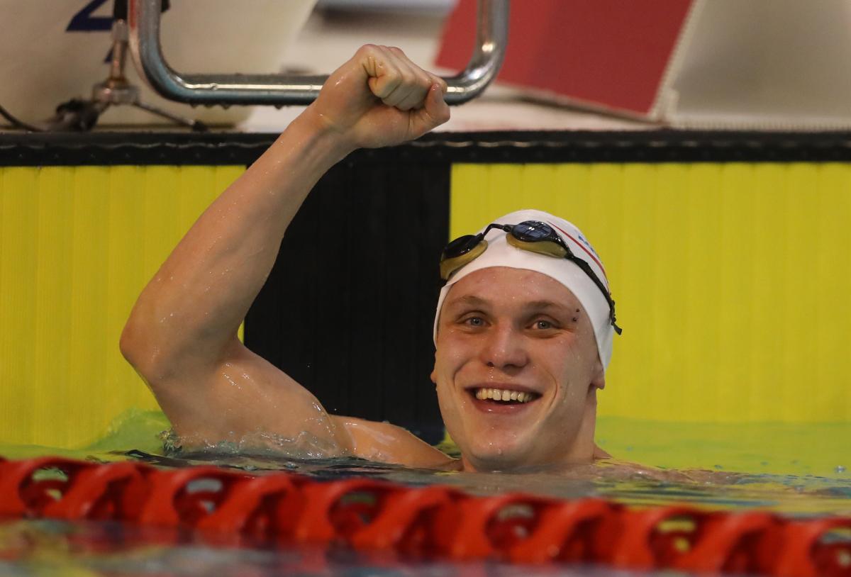 Great Britain's Aaron Moores celebrates breaking the world record in the men's 100m breaststroke final at the 2016 British Para-Swimming International Meet.