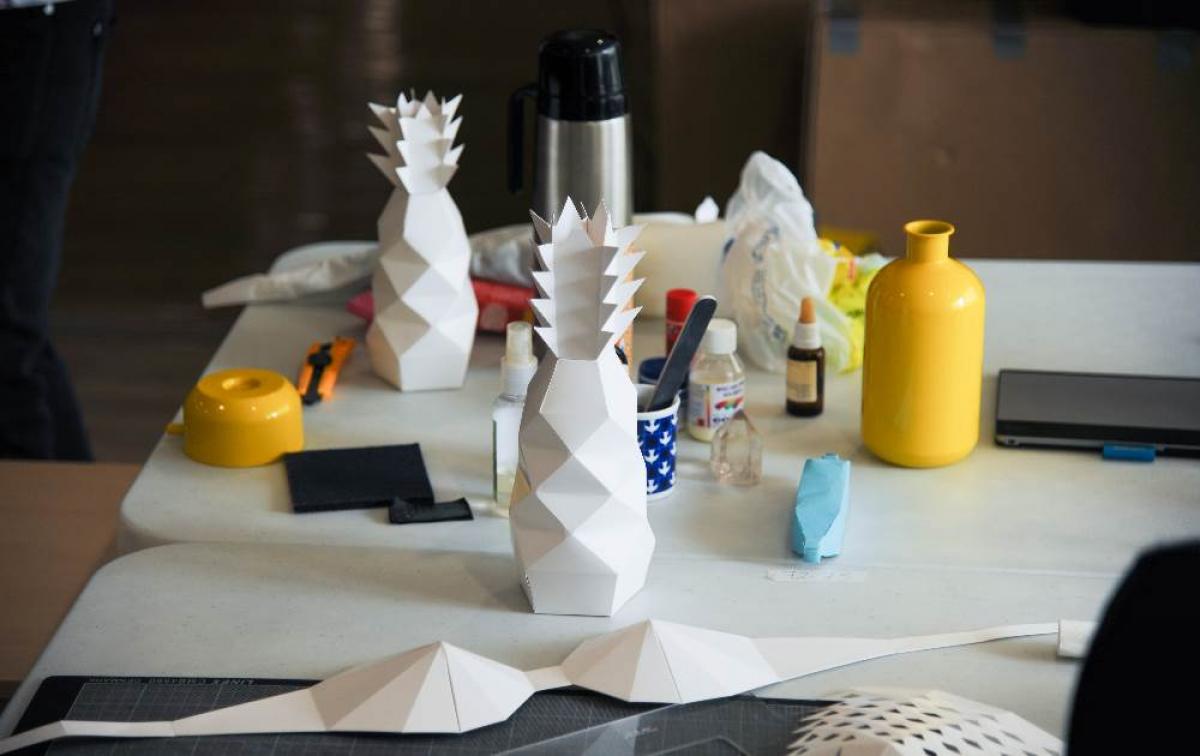 Rio 2016 Opening Ceremony On a table, pineapples and bras made out of paper.
