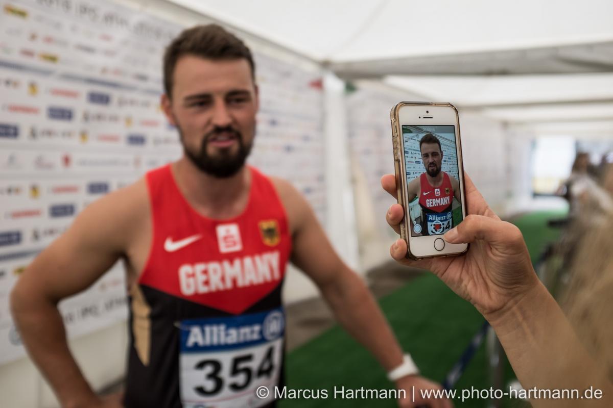 Man being filmed by a smartphone