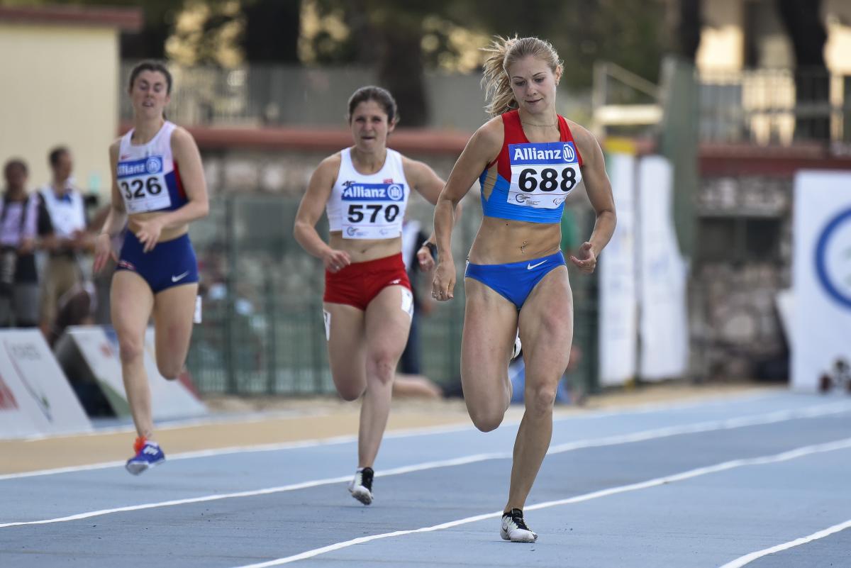 women on the track, running