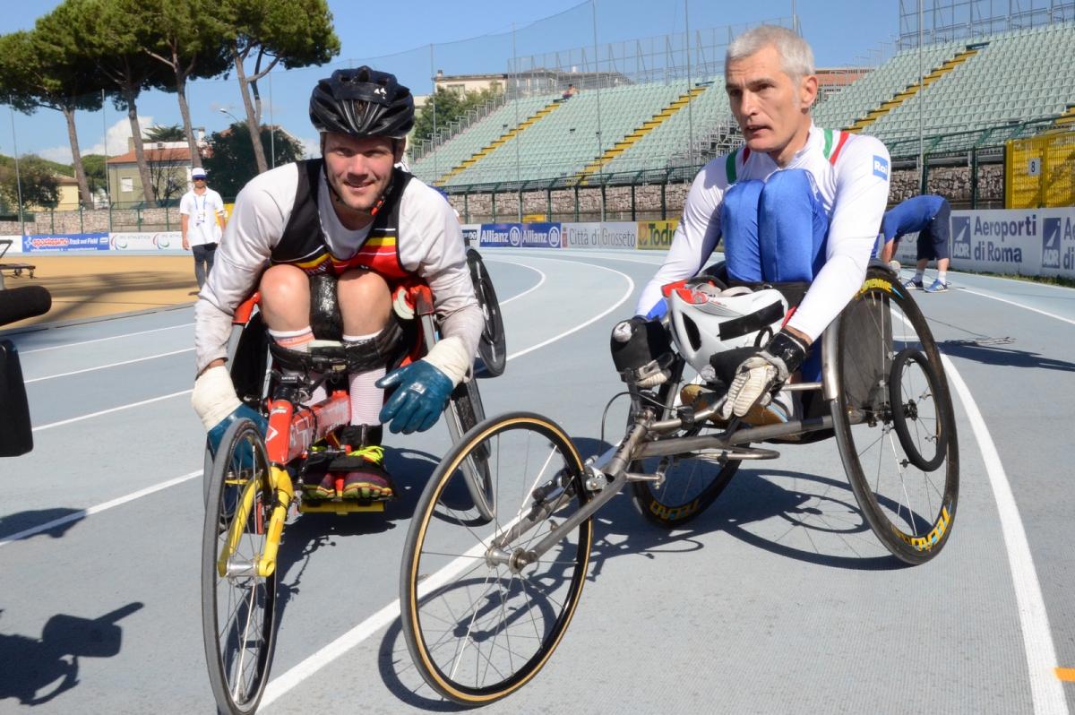 Two wheelchair racers on the track after their race