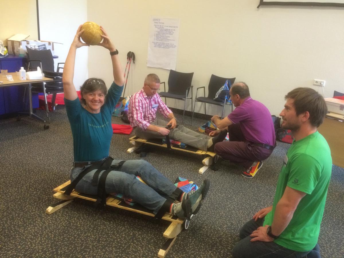 Snow sports classifier training 2016 A woman holds a ball above her head to simulate a classification