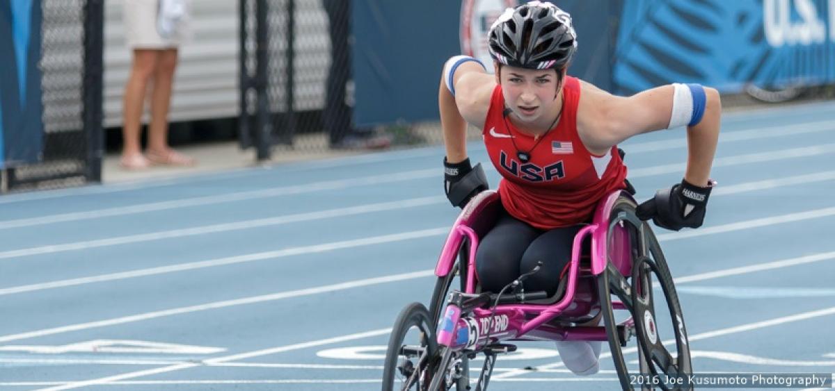 Woman in racing wheelchair