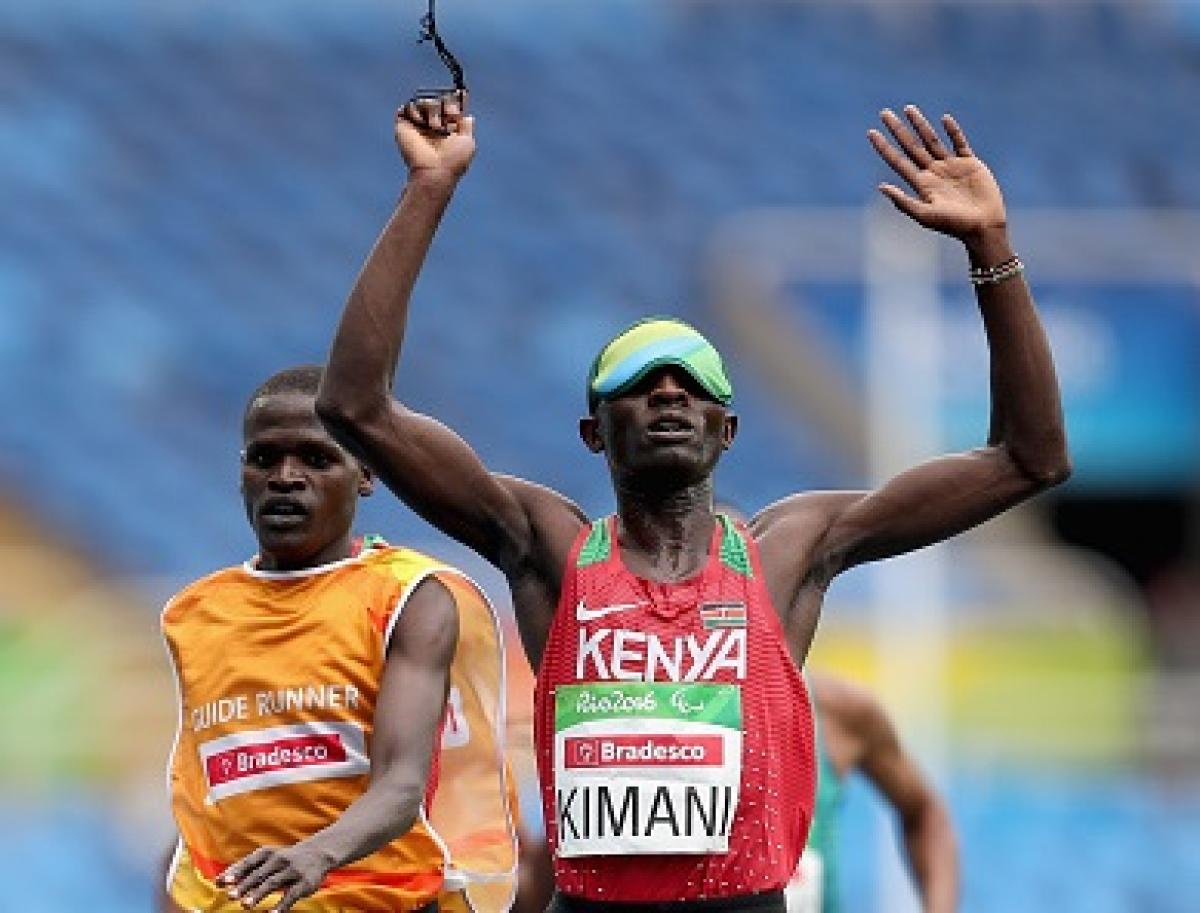 RIO DE JANEIRO, BRAZIL - SEPTEMBER 08: Samwel Mushai Kimani of Kenya crosses the finish line to win the men's 5,000 meter T11 on day 1 of the Rio 2016 Paralympic Games at Olympic Stadium on September 8, 2016 in Rio de Janeiro, Brazil. (Photo by Matthew Stockman/Getty Images)