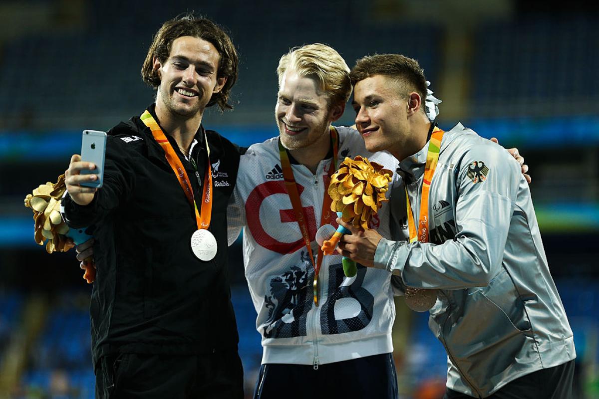 Liam Malone, Jonnie Peacock and Felix Streng take a selfie on the podium Liam Malone, Jonnie Peacock and Felix Streng take a selfie on the podium