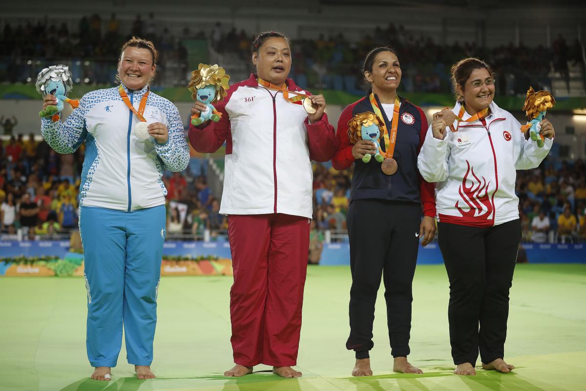 The four medallists from the women's +70kg judo category on the podium at Rio 2016. 