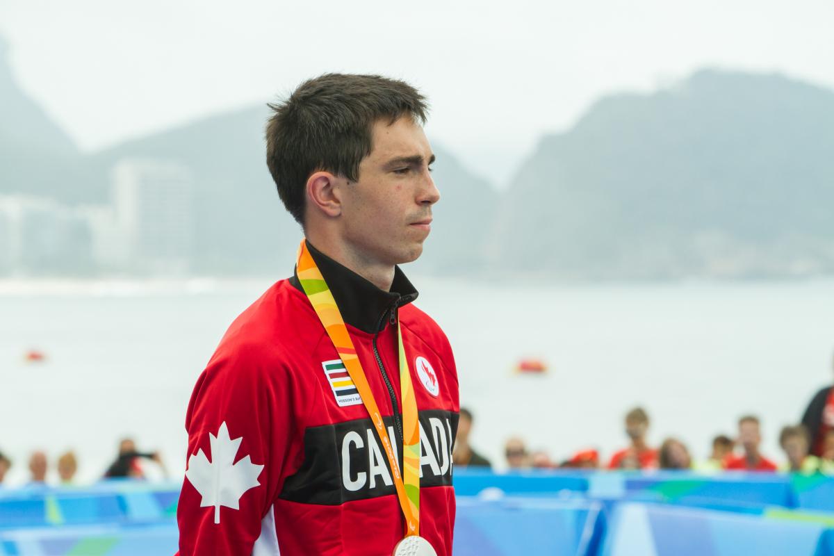 a man stands on a podium