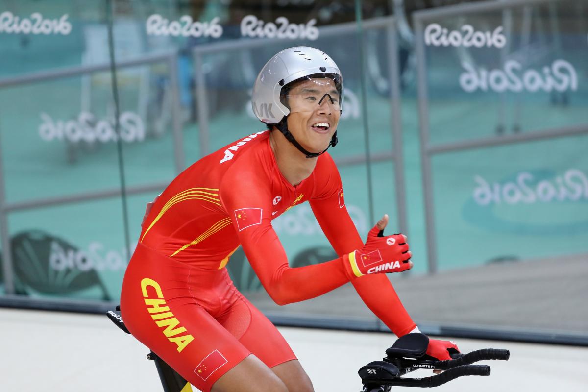 Gold medalist Zhangyu Li of China celebrates after competing in the men's 3km C1 Pursuit Final at Rio 2016 Paralympics at Rio Olympic Velodrome.
