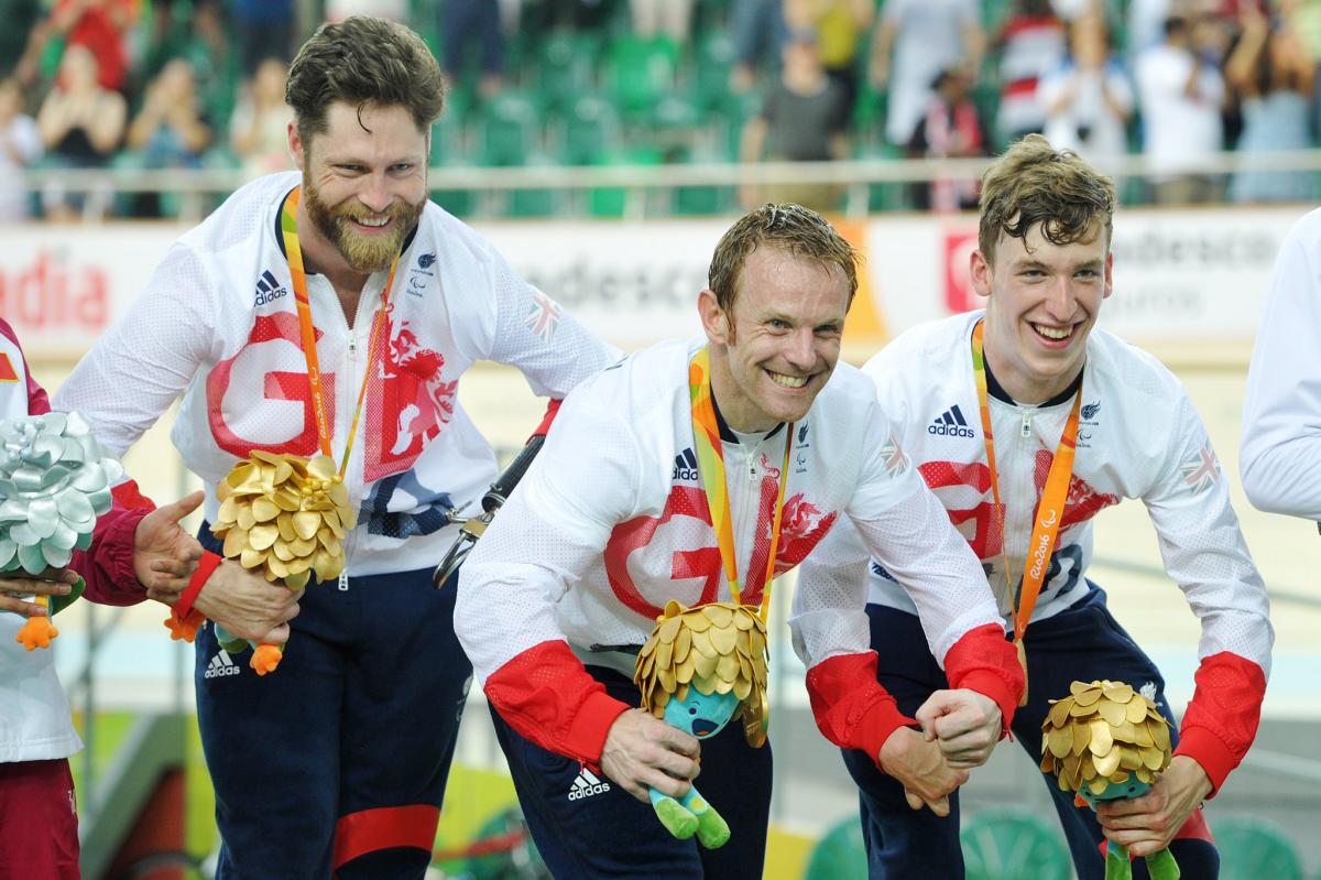 Louis Rolfe, Jon-Allan Butterworth and Jody Cundy celebrate gold medal for team GB